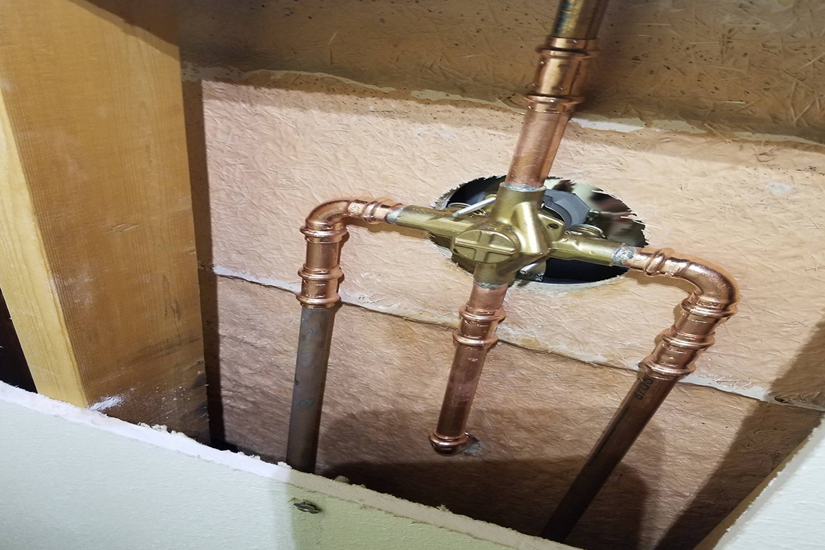 Copper pipe tub and shower valve rough-in inside a wall installed by My Guy Plumbing in Bozeman MT